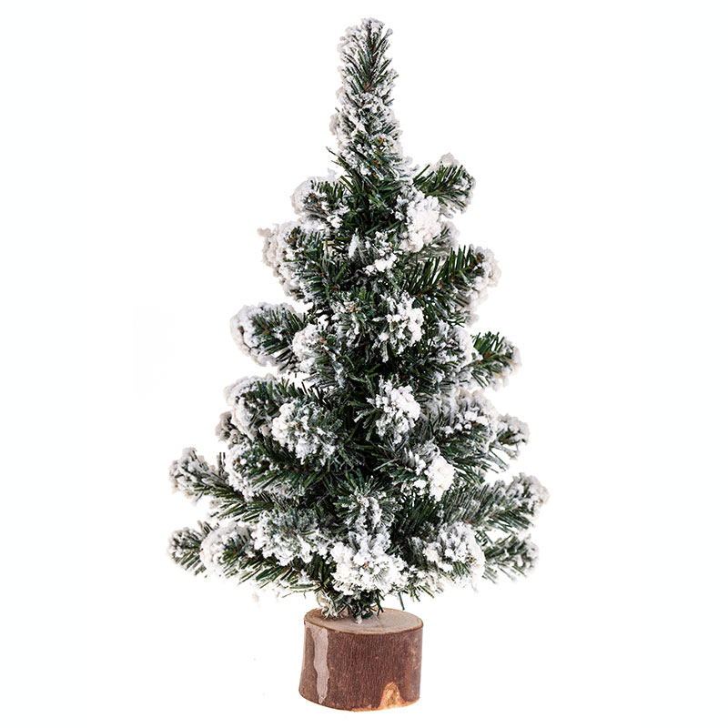 Sapin de Noël enneigé sur rondin