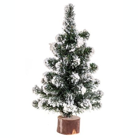 Sapin de Noël enneigé sur rondin